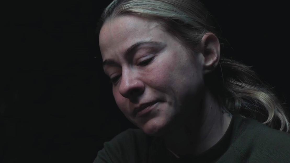 Close-up of Lucy Spraggan appearing upset.