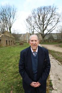 Peter Wellman, the last resident of Tyneham, standing in the abandoned village.