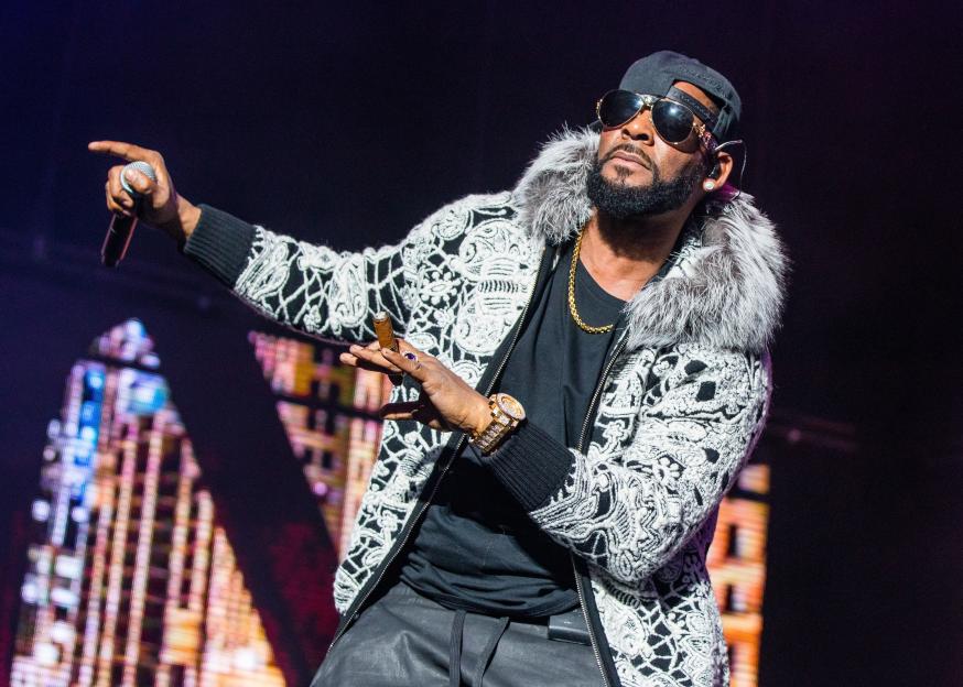 R. Kelly performing on stage.