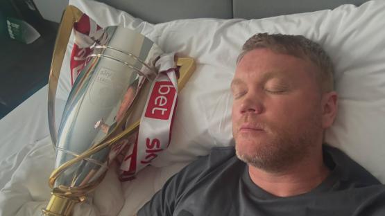 Fans spot something awkward in trophy reflection after Doncaster boss posts pic of himself in bed ‘sleeping’ with cup