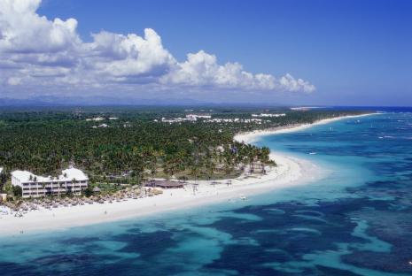 Aerial view of a resort on a tropical beach.