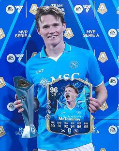 Scott McTominay holding Serie A MVP and Man of the Match awards.