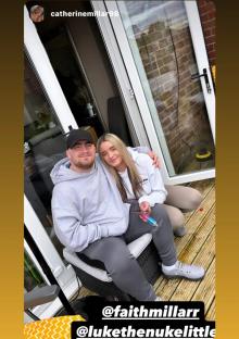 Couple sitting on patio furniture.