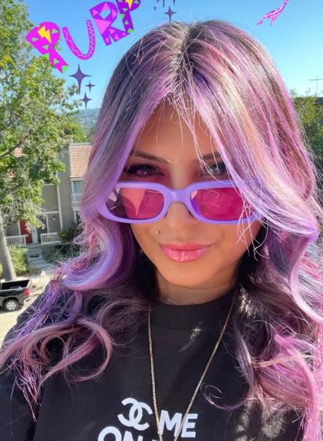 Instagram photo of Jasveen Sangha with purple hair.