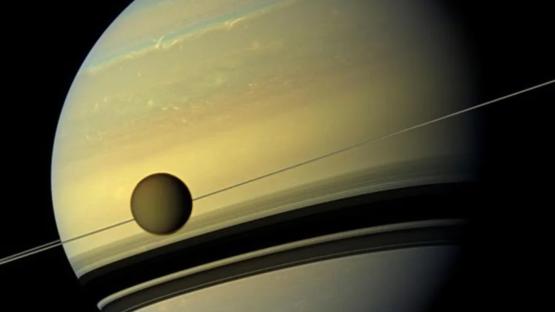 ‘Small population’ of ALIEN life might be lurking on Saturn’s ‘Earth-like moon’ with vast hidden ocean, scientists claim