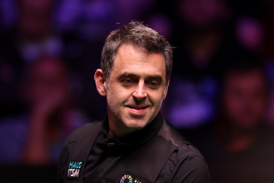 Ronnie O'Sullivan reacting during a snooker match.