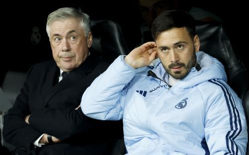 Carlo Ancelotti and Davide Ancelotti at a Real Madrid soccer match.