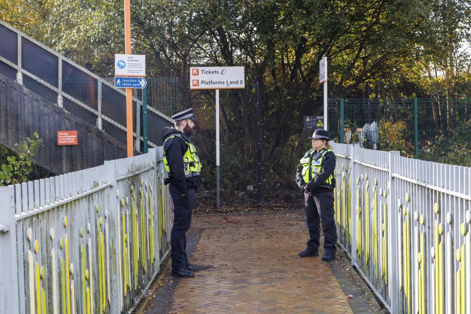 Pic Doug Seeburg - Police on the walkway leading to the Bescot Stadium station where migrant Deng Cholmajek allegedly stabbed hotel worker Rhiannon Whyte to death as she walked to catch the train home