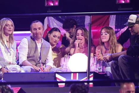 The UK Eurovision delegation reacts to the voting results.