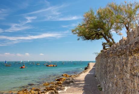 Seaview, Isle of Wight coastline with boats and a stone wall.