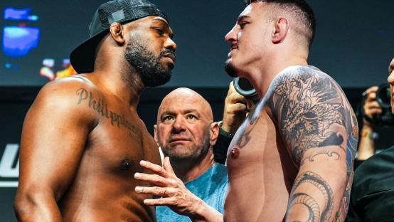 Two shirtless MMA fighters facing each other.