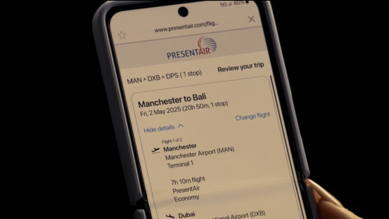 Smartphone displaying a flight itinerary from Manchester to Bali.