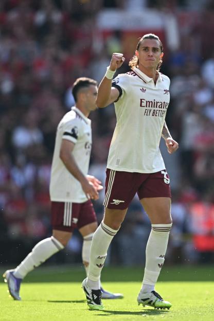 Riccardo Calafiori celebrates scoring a goal for Arsenal.