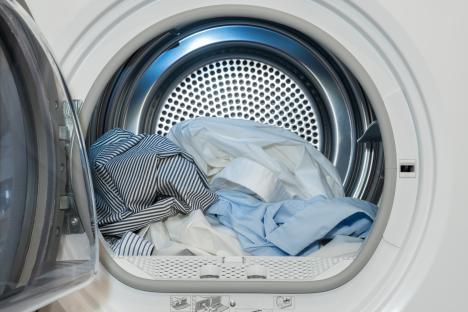 Washed shirts in a clothes dryer.