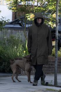 Liam Gallagher walking a dog.