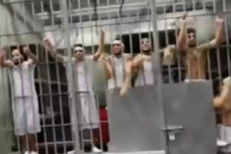 Moment deported Tren de Aragua gang inmates scream and rattle cells at US officials in notorious El Salvador mega-prison