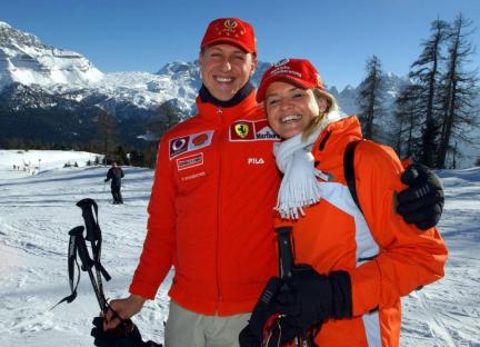 Michael Schumacher and Corinna Schumacher skiing in the Alps.