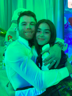 A man and woman embracing.