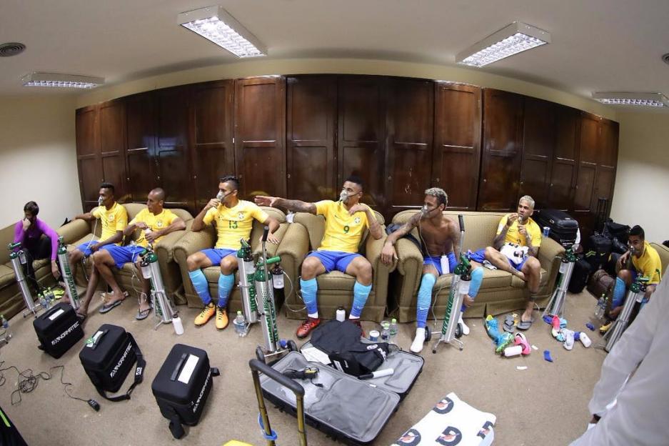 Brazilian soccer players using oxygen in the locker room.