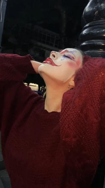 Woman in clown makeup in a final video before disappearance.