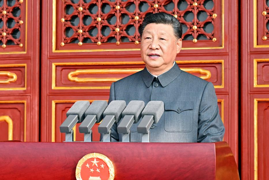 Xi Jinping speaking at a podium.