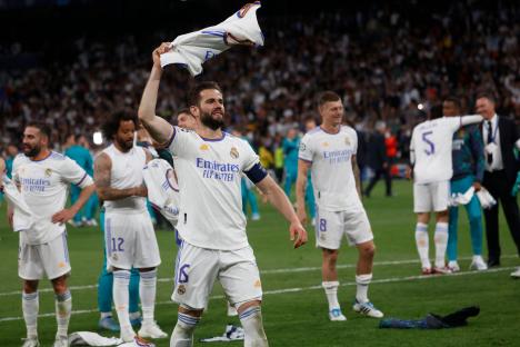 Real Madrid players celebrating a victory.