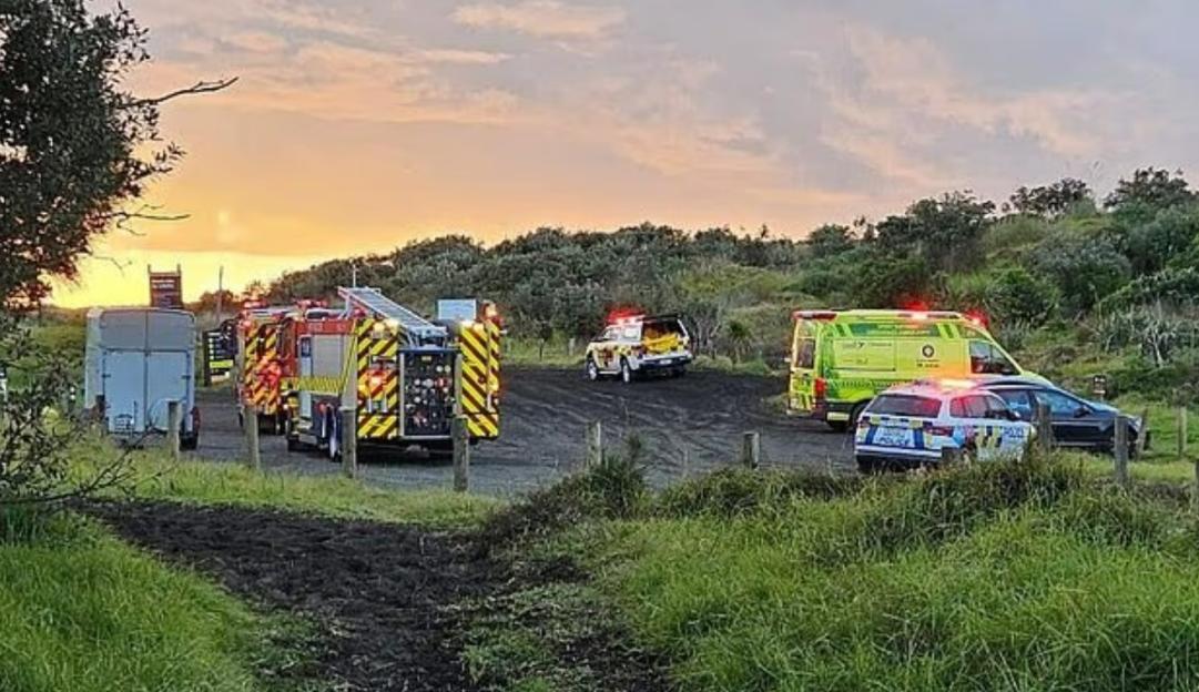 Emergency vehicles at a beach.