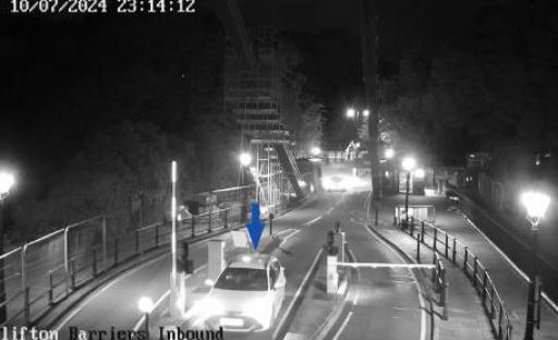Nighttime security camera image of a car approaching Clifton Bridge toll barriers.