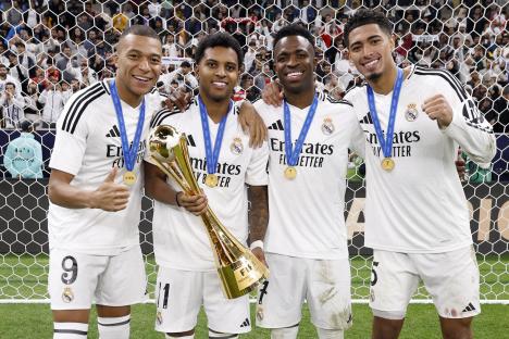 Real Madrid players with the 2024 FIFA Intercontinental Cup trophy.