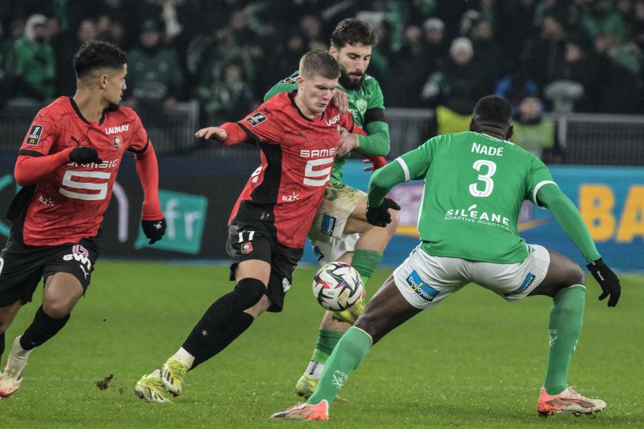 Soccer players vying for the ball.