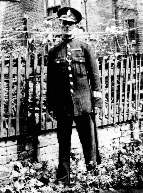 Black and white photo of John Reginald Halliday Christie in a special constable uniform.