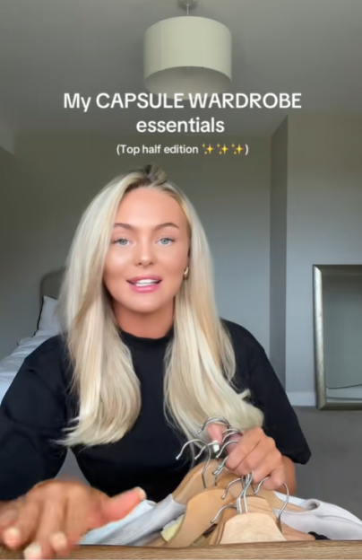 Woman showing capsule wardrobe essentials.