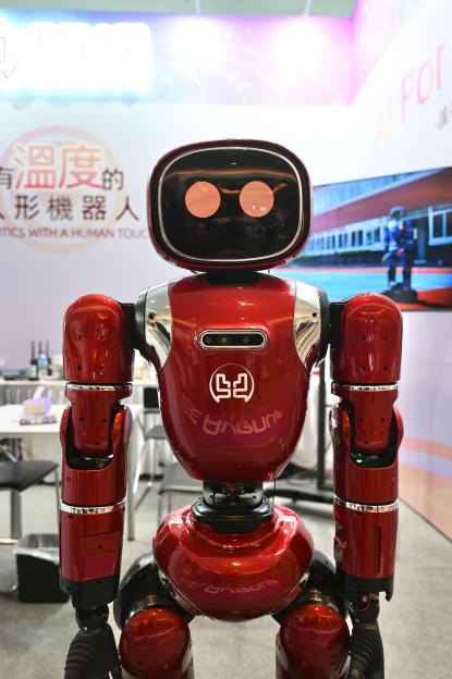 Red humanoid robot named DAGUNG at the Hong Kong Electronics Fair.