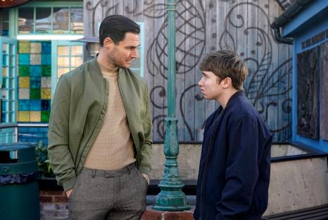 Still image from EastEnders episode 7125 showing Zack Hudson and Barney Mitchell in conversation.