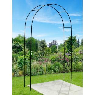 Black metal garden arch in a garden.