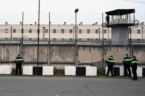 Police officers guarding a prison.