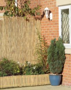 Bamboo fence and border installed in a garden.