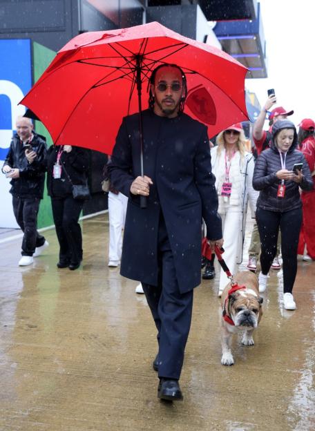 Ferrari driver Lewis Hamilton with his dog Roscoe ahead of the British Grand Prix at Silverstone Circuit, Northamptonshire. Picture date: Sunday July 6, 2025. PA Photo. Photo credit should read: Andrew Matthews/PA Wire. RESTRICTIONS: Use subject to restrictions. Editorial use only, no commercial use without prior consent from rights holder.