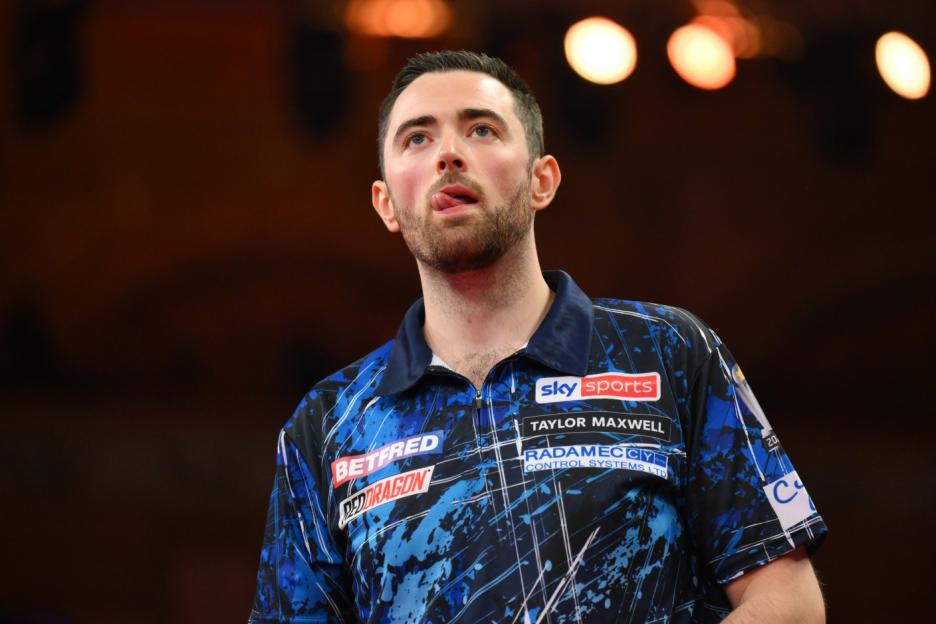 BLACKPOOL, ENGLAND - JULY 21: Luke Humphries of England looks on against Michael Van Gerwen of Netherlands during the Final of the Men's 2024 Betfred World Matchplay Finals at Winter Gardens on July 21, 2024 in Blackpool, England. (Photo by Ben Roberts Photo/Getty Images)