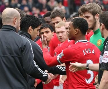 Luis SuÃ¡rez of Liverpool refusing to shake Patrice Evra's hand.