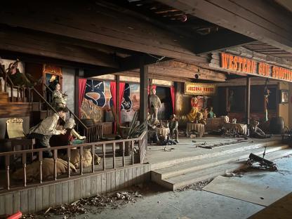 Derelict Western-themed stage in an abandoned Japanese theme park.