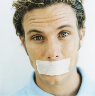 Man with tape over his mouth.