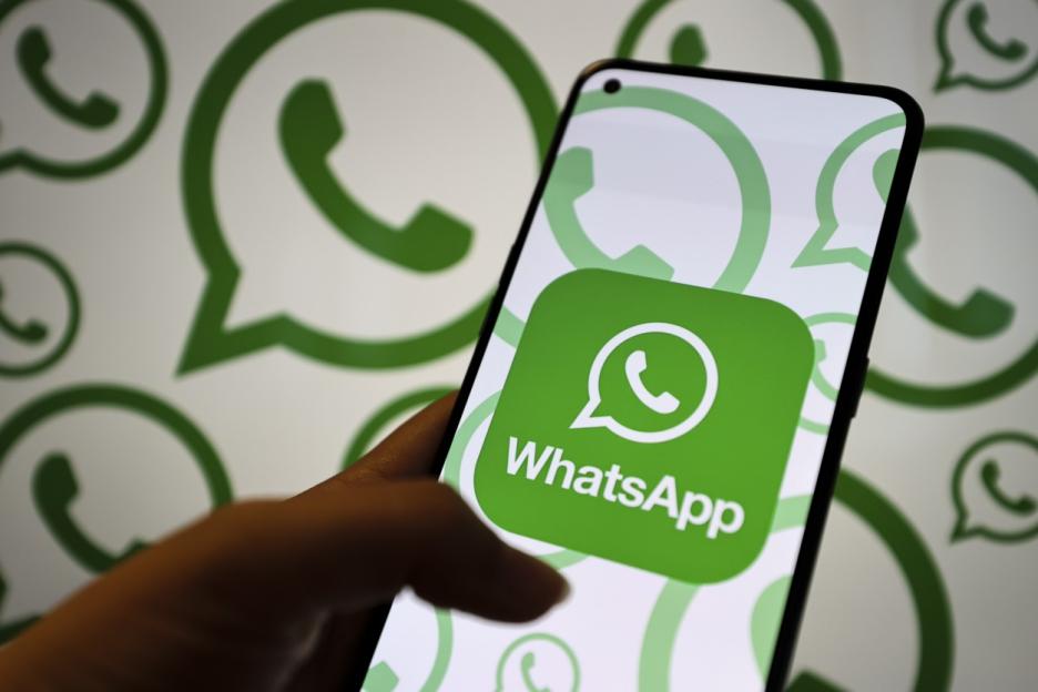 WhatsApp logo on a smartphone.