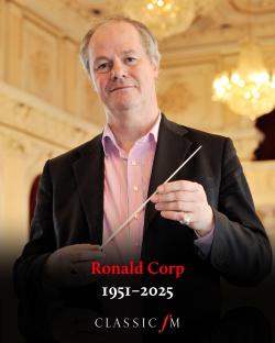Photo of Ronald Corp, 1951-2025, holding a baton.