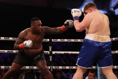 TELFORD, ENGLAND - MARCH 04: Godson Umeh punches Tempo Arts during the heavyweight match between Tempo Artsand Godson Umeh at Telford International Centre on March 04, 2023 in Telford, England. (Photo by Nathan Stirk/Getty Images)