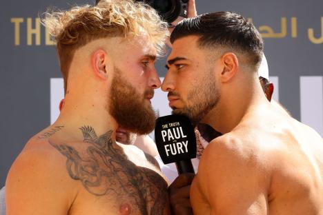 Jake Paul and Tommy Fury face off at a weigh-in.