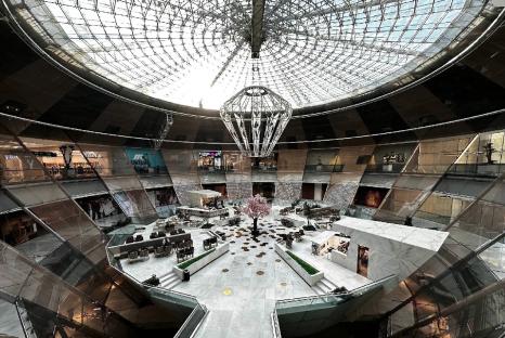 Interior view of Iran Mall in Tehran, showing its multi-level design and glass ceiling.
