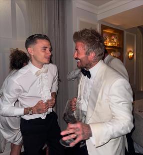 Romeo and David Beckham at a celebratory event.