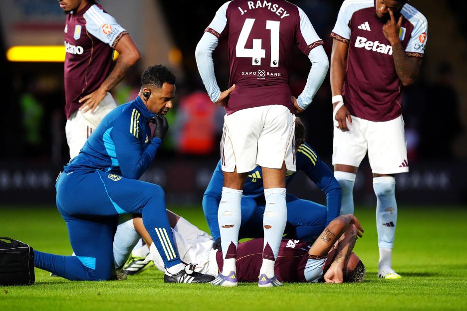 Soccer player receiving medical attention on the field.