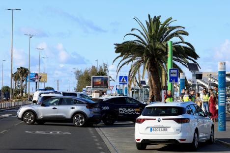 Spanish National Police officers at an airport following a police shooting.